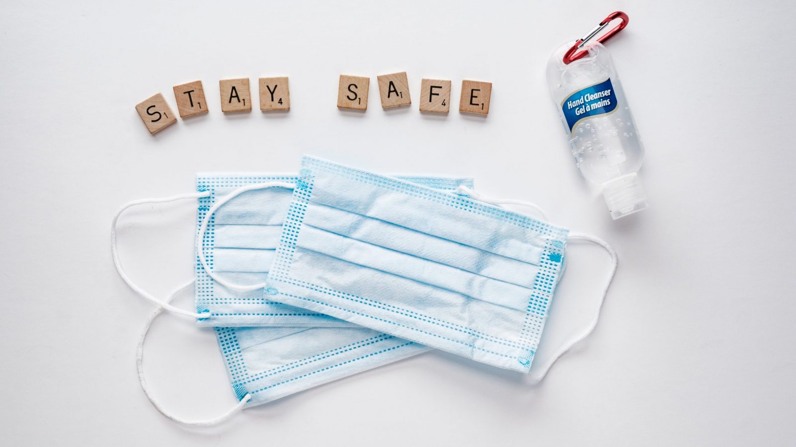 hand-sanitizer-face-masks-and-letter-tiles-spelling-safe-hands